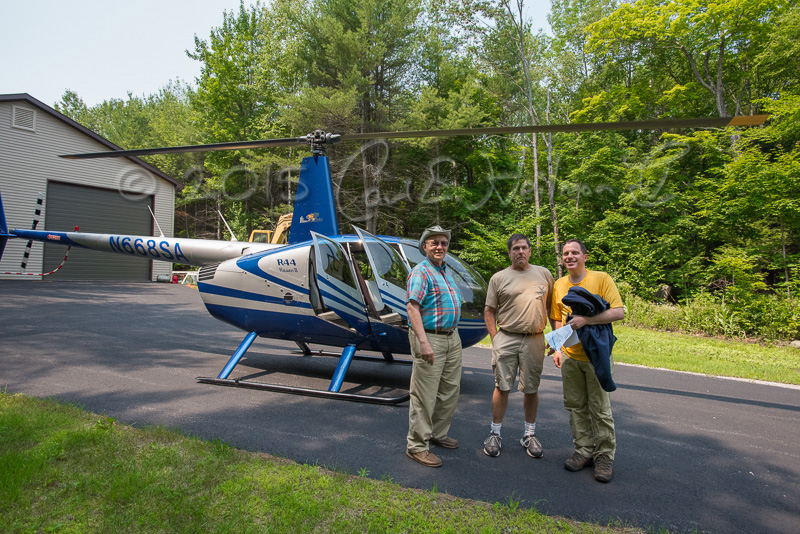 Gerald Malovany, Bruce Mowery of North Country Heliflite, and LGLC executive director Jamie Brown