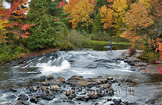 Photographing at Bog River Falls during a Wild Center workshop