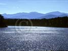 Canoe on Second Pond in the Saranac Lakes chain - from The Adirondacks pub by Rizzoli - nature photography wallpaper copyright Carl Heilman II, Brant Lake, New York